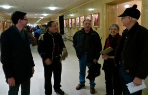 Individuals concerned about what happens to the Killdeer Mountains chat before the public hearing at the Bismarck capitol on January 24, 2013.